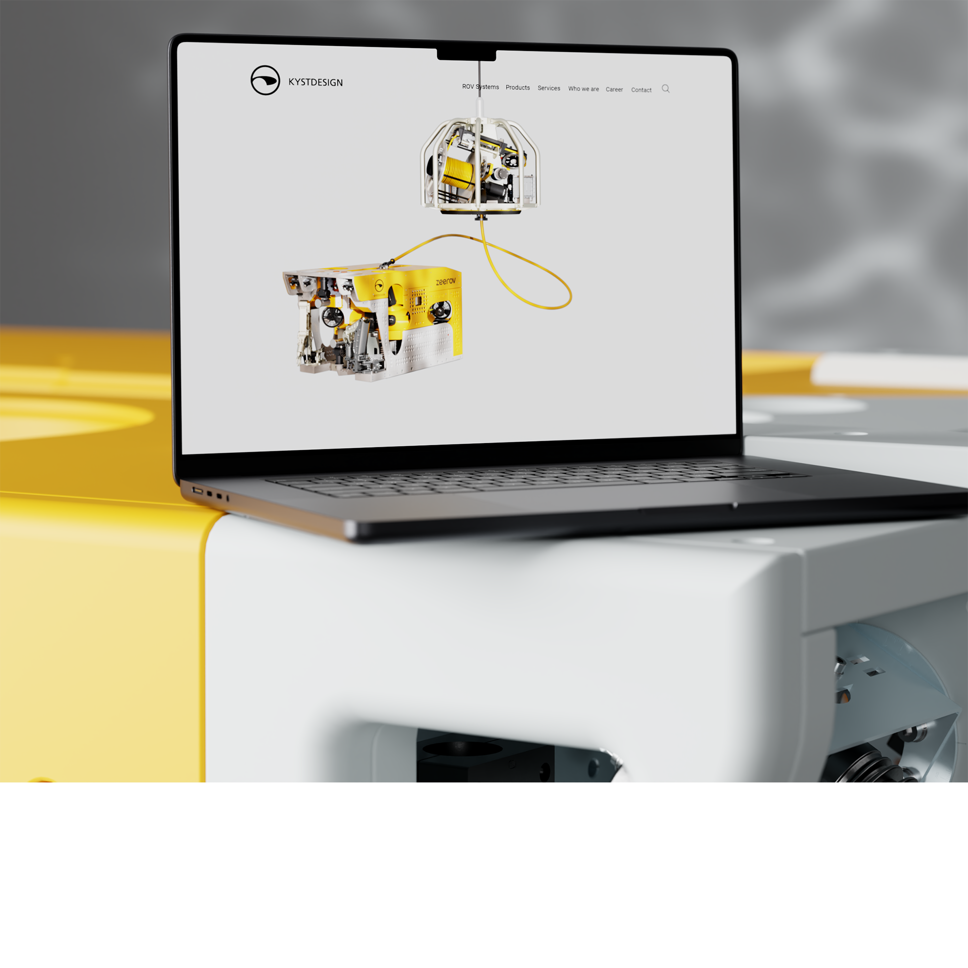 Mockup, PC som viser forsiden på kystdesign.no, står oppå en ROV
